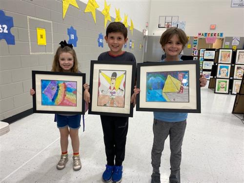 kids holding art