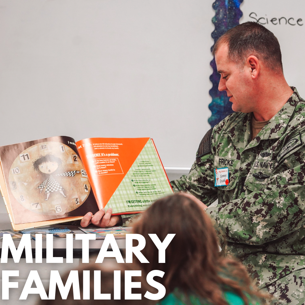 A Dad in Military uniform reading to a class of students